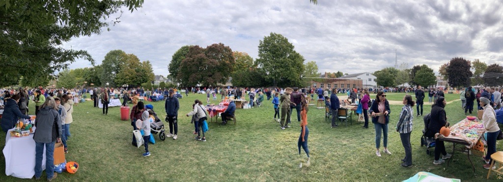 People enjoying Harvest Fair at Greene's Field in October of 2022