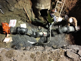 Improved Infrastructure - Men working on a pipe